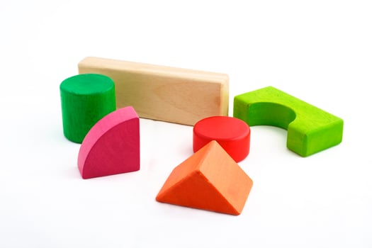 Wooden toy blocks on white background photo