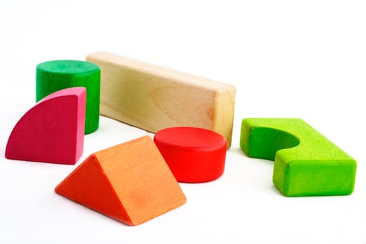 Wooden toy blocks on white background photo