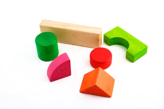 Wooden toy blocks on white background photo
