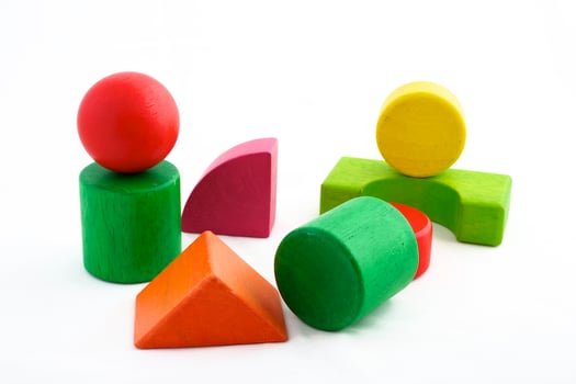 Wooden toy blocks on white background photo