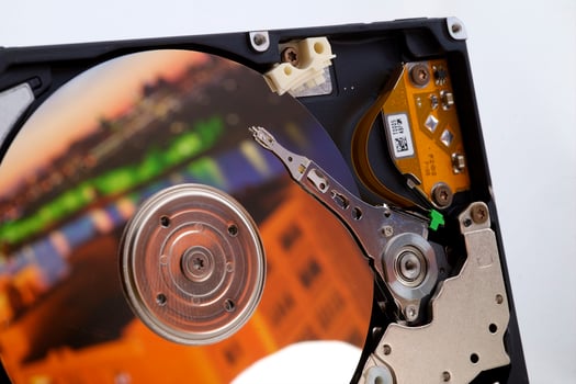 Close-up inside view of hard disk isolated on white background photo