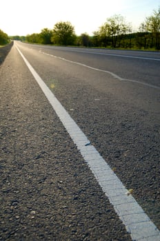 Asphalt road on a decline photo
