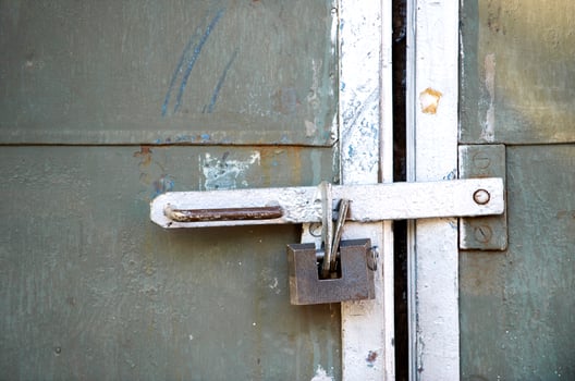 Old lock on the shabby wall photo