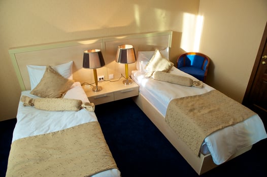 Hotel bed room interior. Sunset light. photo