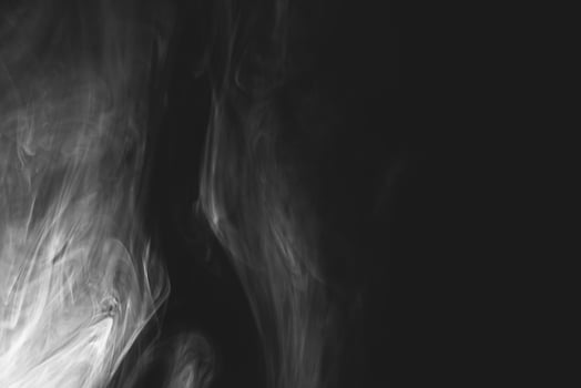 White smoke isolated on black background photo