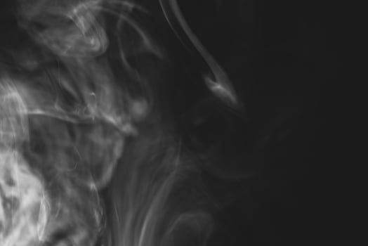 White smoke isolated on black background photo