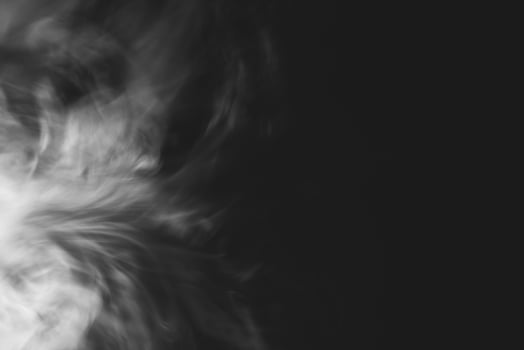 White smoke isolated on black background photo