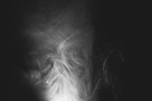 White smoke isolated on black background photo