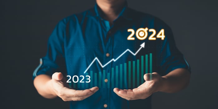 Businessmen hold target 2024 and progress of business and analyze financial, and investment. plan strategy to success goals and growth stock. online business, e-commerce, online marketing. photo
