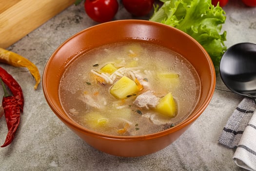 Homemade chicken soup with vegetables photo