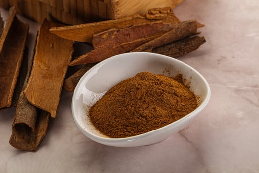 Natural Cinnamon powder with sticks photo