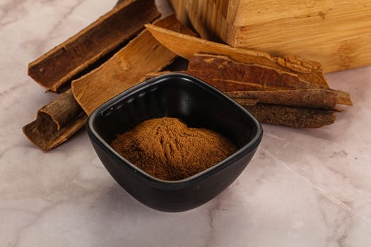 Natural Cinnamon powder with sticks photo