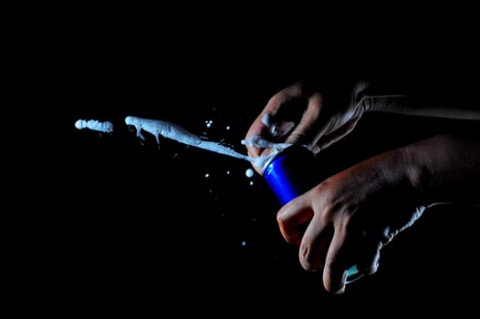 close up of a hand opening soda can photo