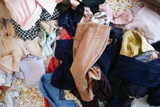messy bed with cloths in early morning , messy bed after waking up photo