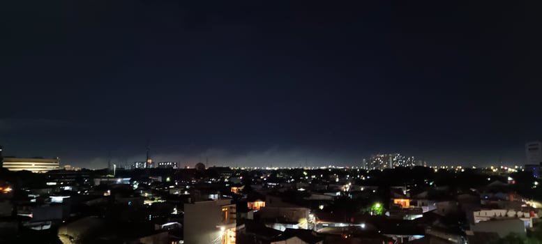 View of houses and buildings at night photo