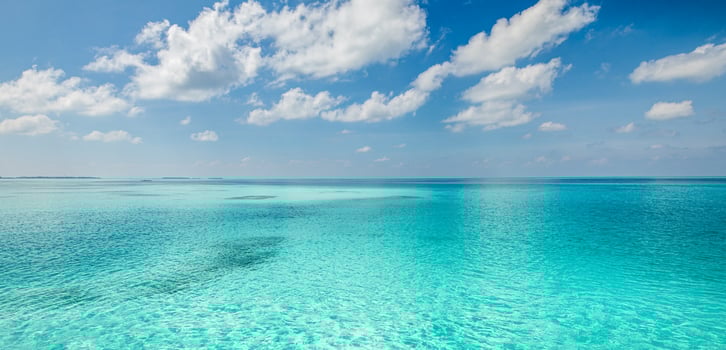 Relaxing seascape with wide horizon of the sky and the sea. Panorama of tropical beach seascape horizon. Abstract bright sunshine sky light tranquil relax summer seascape freedom wide angle photo