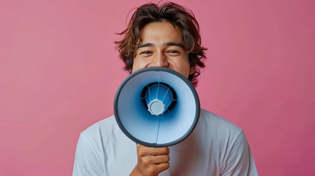 Man Holding Blue and Black Megaphone photo