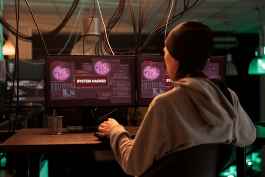 Encryption specialist looking at alert message to hack system, trying to break into computer server and database. Male thief planting trojan virus to create malware, hacking network. photo