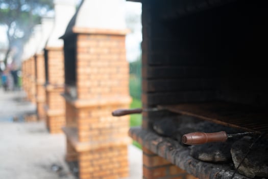 Outdoor BBQ made of bricks for cooking in public park photo