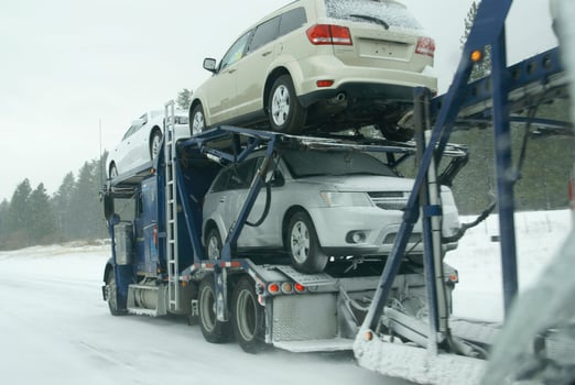 Large trucks fight a winter storm photo
