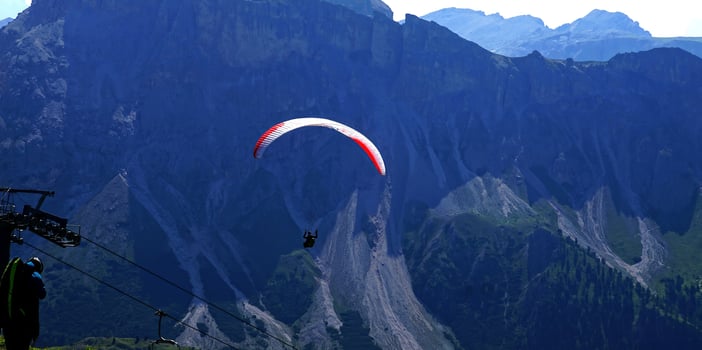 Parapentes launched from a high alpine meadow photo
