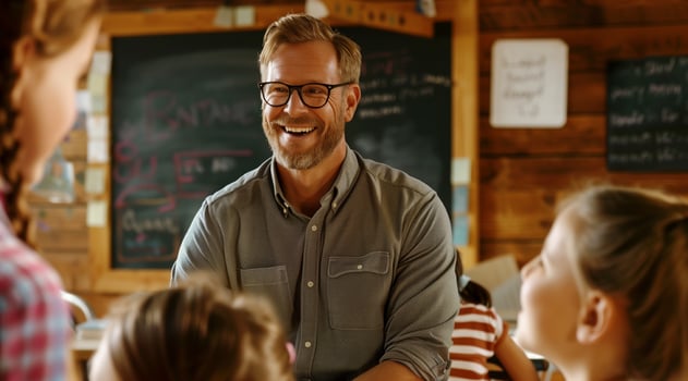 portrait of a caucasian teacher in the classroom, child behind him photo
