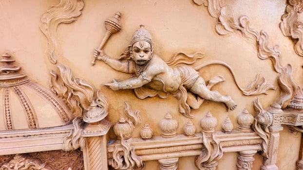 Hanuman's tail on fire and parade him around the streets of Lanka photo