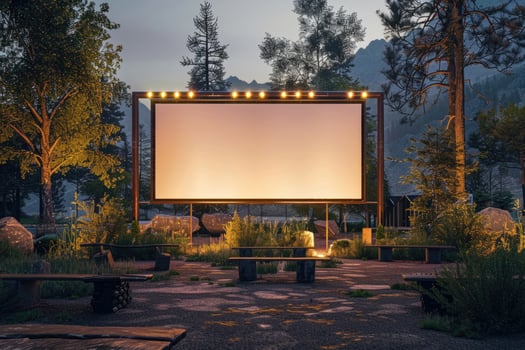 blank white screen outdoors in green grass park. outdoor cinema, big screen show. photo