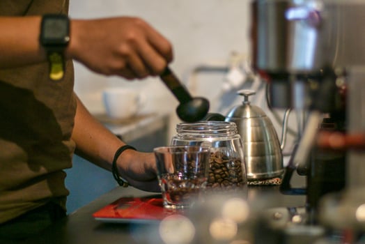 Midsection of Barista making Coffee Beverages photo