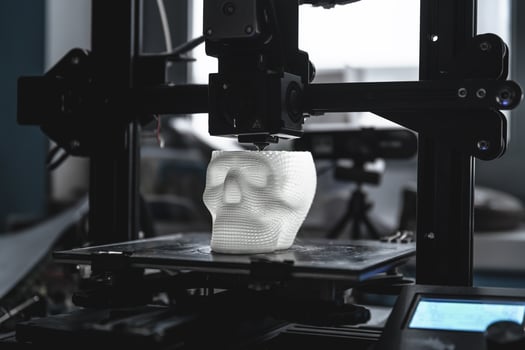 The 3D printer prints white plastic model photo