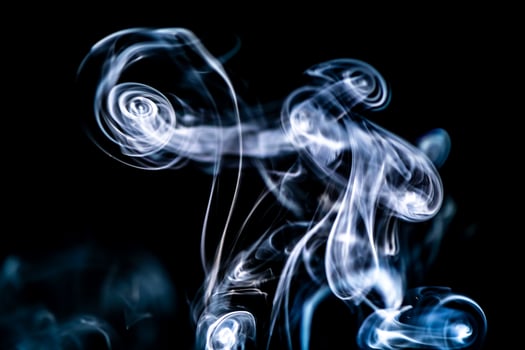 blue smoke, vapor, fog cloud on black background for using in composition and overlay photo