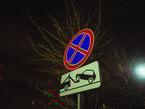 No parking any time punishment symbol, evacuation of car. photo