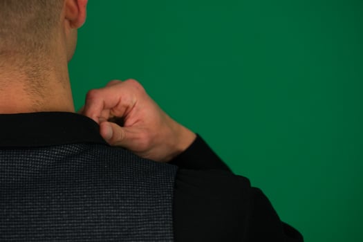 close-up of a man's hands straightening a black shirt, he gives us the background of a vest of a classic suit, shoulders from different sides, set Three photos