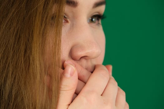 Girl shouting over isolated green background photo