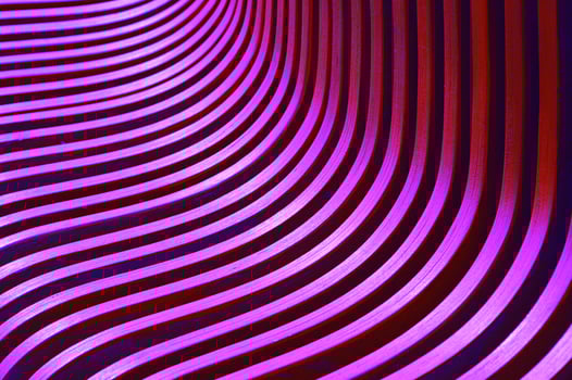 Curved slats, planks, boards. Element of building facade, benches. Beautiful pink purple abstract background. photo