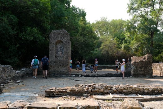 Albania 09.09.2023 Ruins of Great Basilica in Butrint National Park, Buthrotum, Albania. Triconch Palace at Butrint Life and death of ancient Roman house Historical medieval Venetian Tower surrounded photo