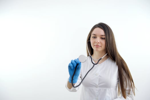 excited medical doctor woman happy smile point finger at you, isolated over white background photo