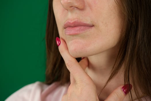 Pensive business woman portrait over a green background photo