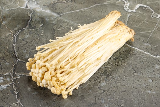 Tasty raw enoki mushroom heap photo