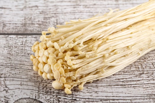 Tasty raw enoki mushroom heap photo