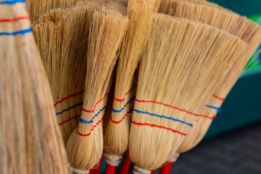 bunch of brooms with red and blue stripes photo