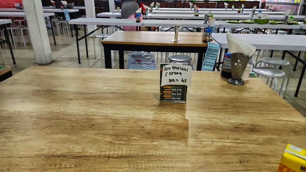 a table with a bottle of ketchup on it photo