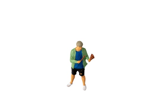 Miniature people , A young man with a BBQ Isolated on white background with clipping path photo