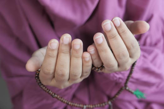 young muslim women praying during ramadan photo