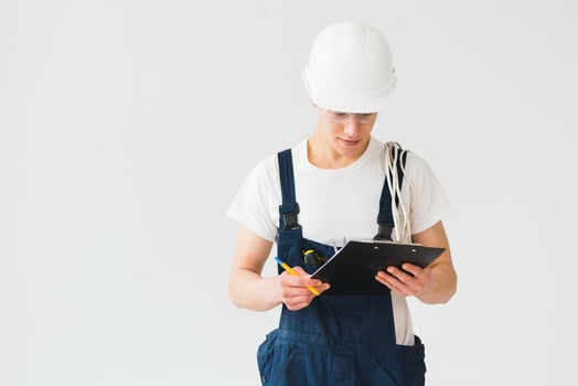 Builder in helmets on a white background photo