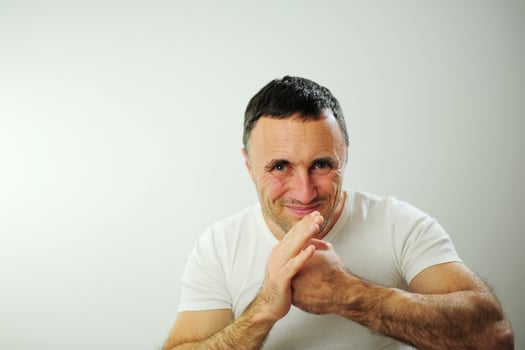 Hit from the left adult man is angry and hits his hand with his fist his hairy strong hands he has black hair and gray Dissatisfaction expressing negative emotions You will get what you deserve photo