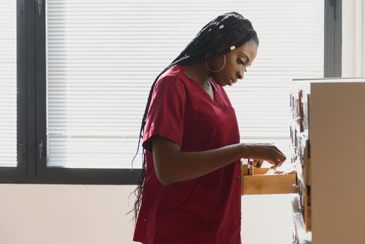 Young beautiful African American girl doctor in a white coat with a stethoscope. photo