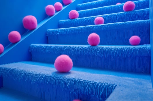 Blue stairs with pink wool balls photo