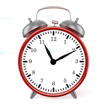 Red retro styled classic alarm clock isolated photo