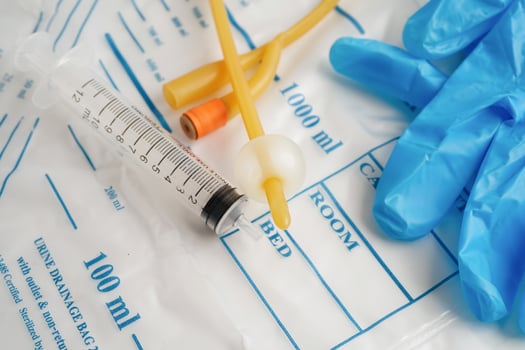 Foley catheter and urine drainage bag collect urine for disability or patient in hospital. photo